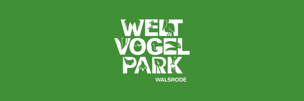 Banner con el logotipo de Welt Vogel Park Walsrode sobre fondo verde